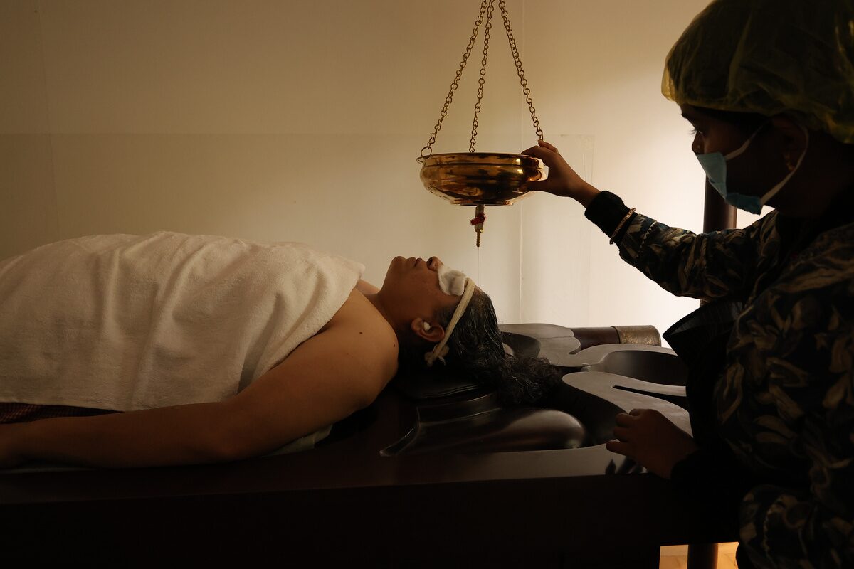 A guest receiving a wellness therapy